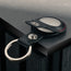Close up of the press stud clasp on the Black with Red Detail Leather Apple AirTag Holder Keyring