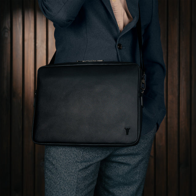 Removing laptop from the Black Leather Messenger Bag