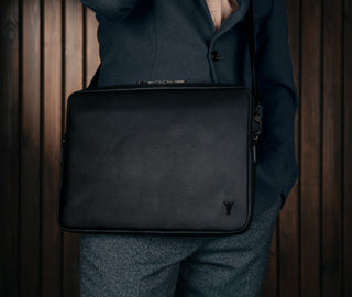 Removing laptop from the Black Leather Messenger Bag
