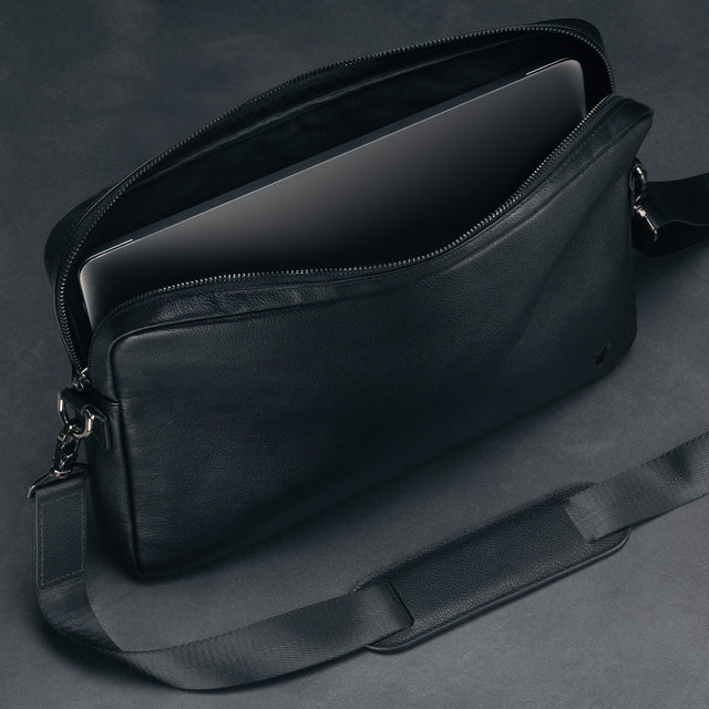 Protective leather flap on the inside of the Black Leather Messenger Bag