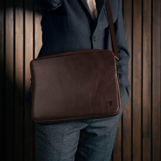 Man carrying the Dark Brown Leather Messenger Bag
