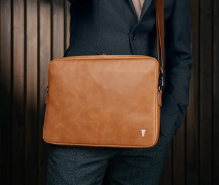 Man carrying the Tan Leather Messenger Bag