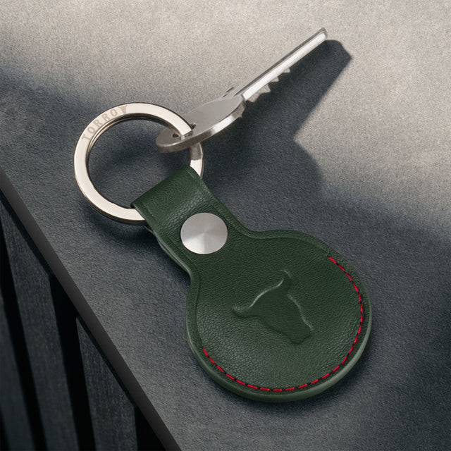 Green with Red Detail Leather Apple AirTag Holder Keyring attached to key
