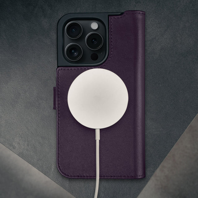 MagSafe charger attached to the Purple Leather Case for iPhone 16 Pro