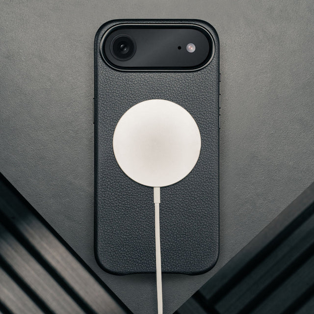 MagSafe charger attached to the Black Leather Bumper Case for iPhone 17 Air