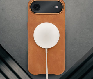 MagSafe charger attached to the Tan Leather Bumper Case for iPhone 17 Air