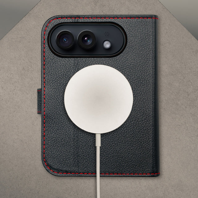 MagSafe charger attached to the Black with Red detail Leather Wallet Case for the iPhone Ultra