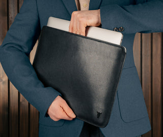 Man taking laptop out of the Black Leather MacBook Pro / MacBook Air Sleeve Case