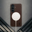 Wireless charger attached to the Dark Brown Leather Bumper Case for Galaxy S26